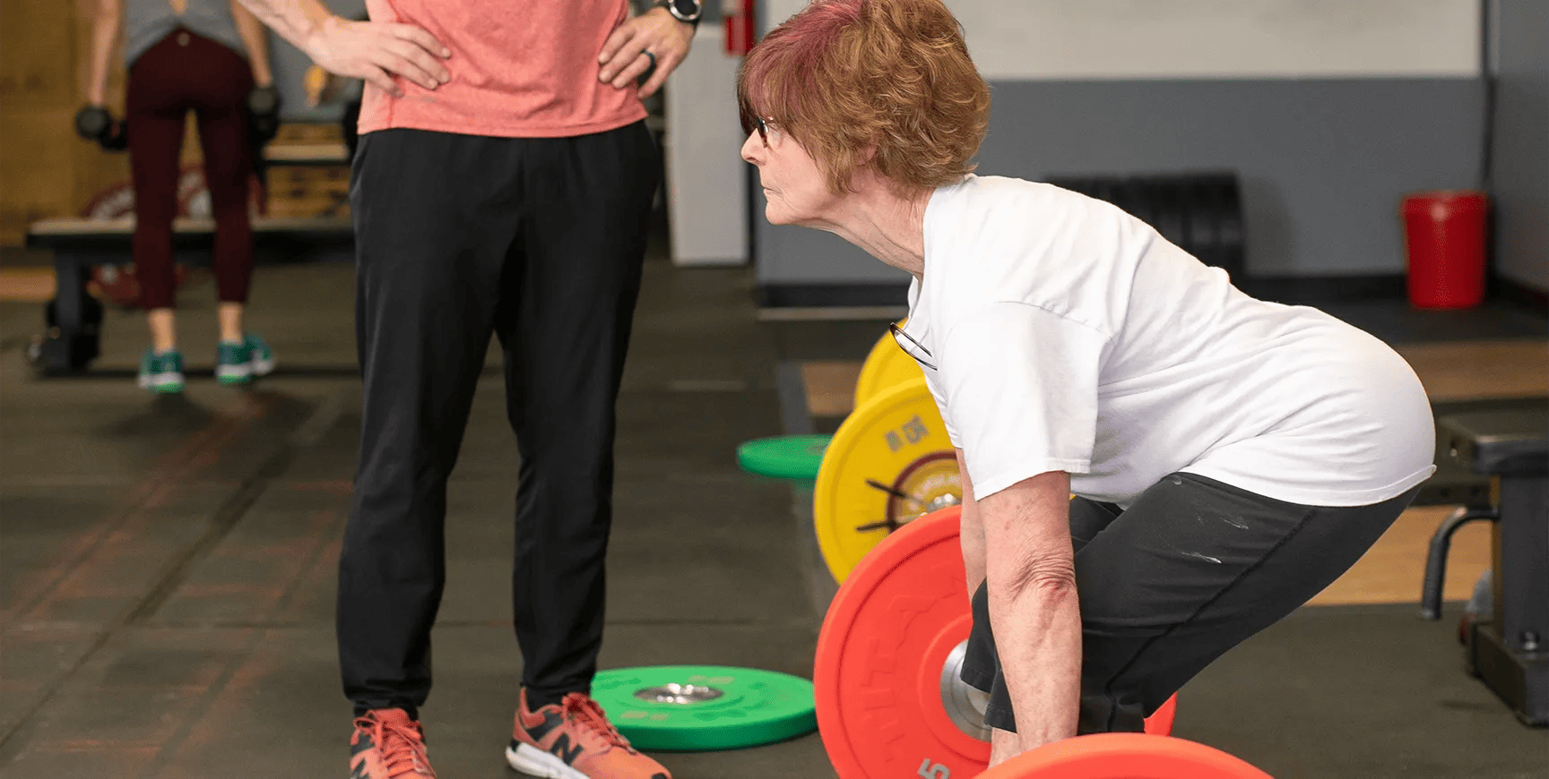 woman training with her personal trainer at MET-Fitness