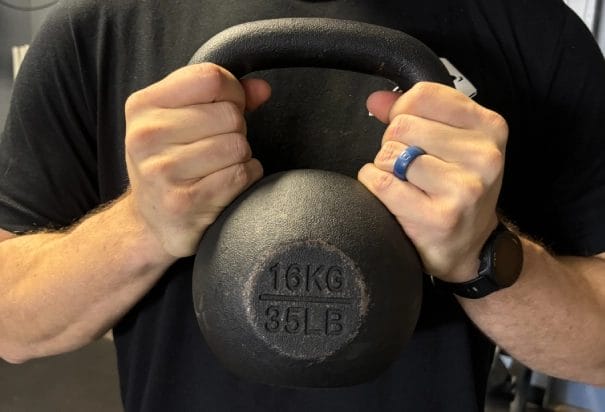 man hold kettlebell